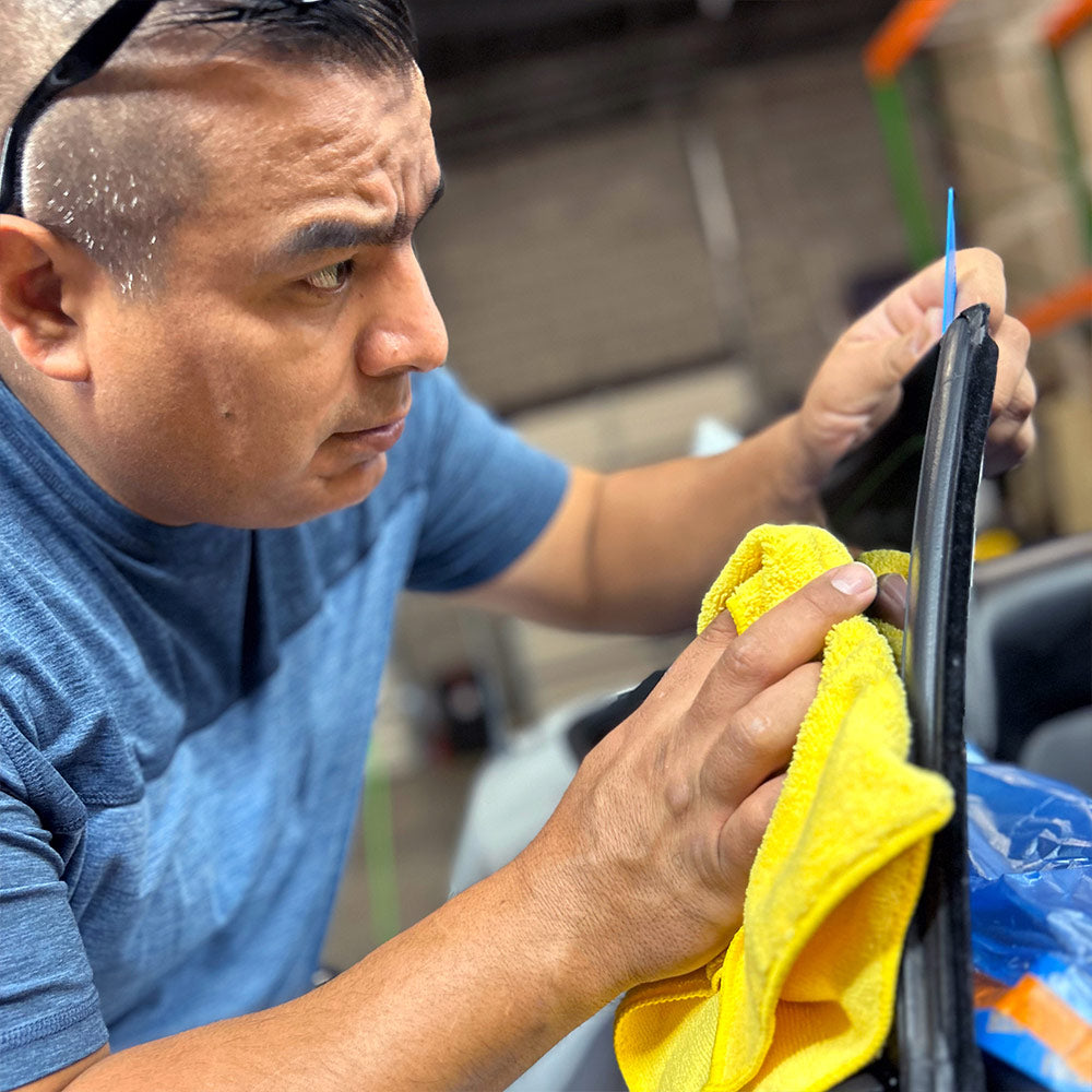 Professional during window tint installation
