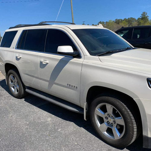 White Tahoe SUV after window tint installation