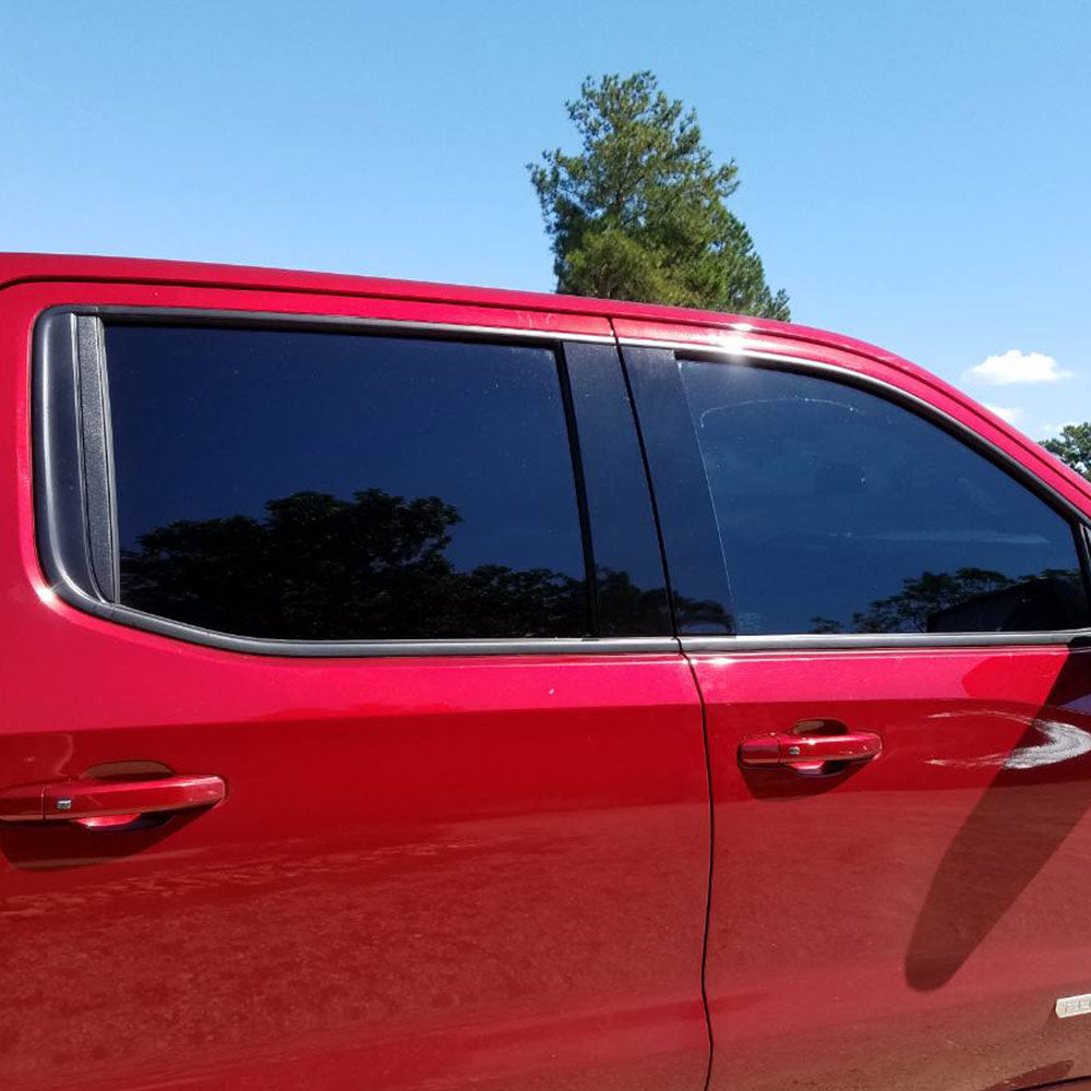 Dark window tint on red truck