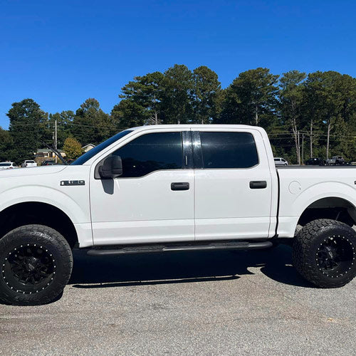 White truck with dark window tint