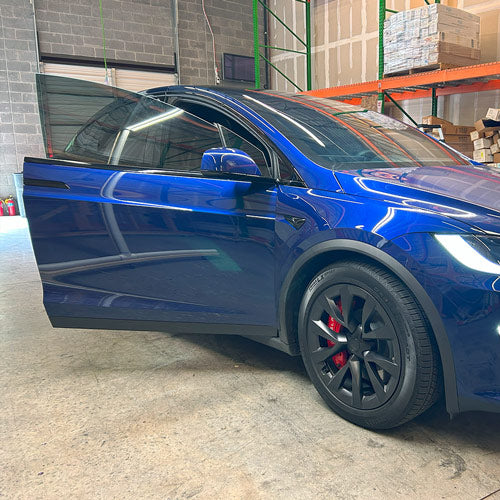 Tesla Model X during window tint installation